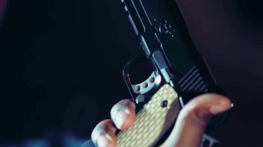 Feature | holding a gun | Gun Control Won't Solve the Problem In The USA [Video] | pro gun control