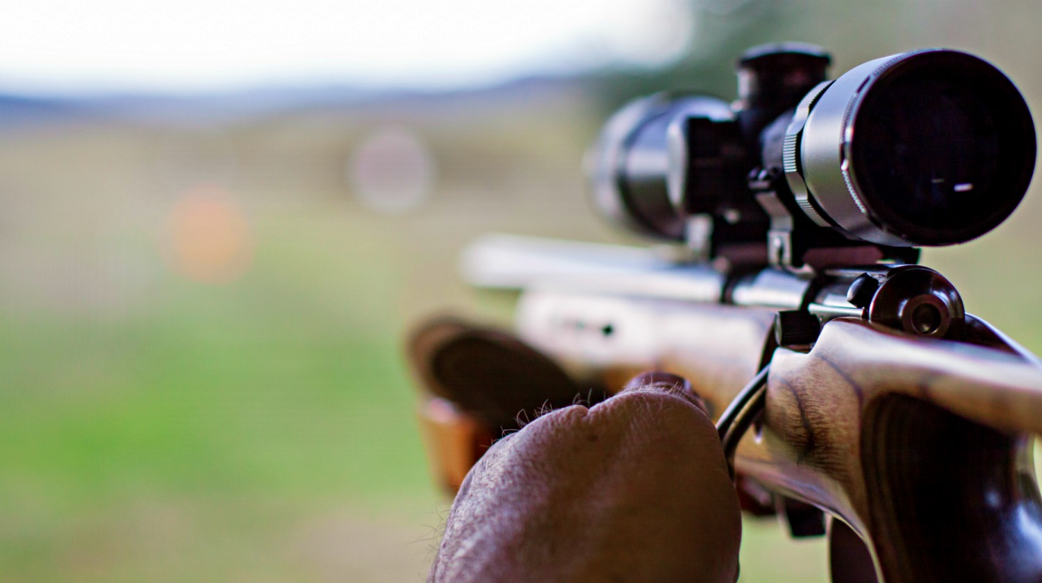 Feature | A shooter sighting in the target | The 22 Rifle In All Its Glory