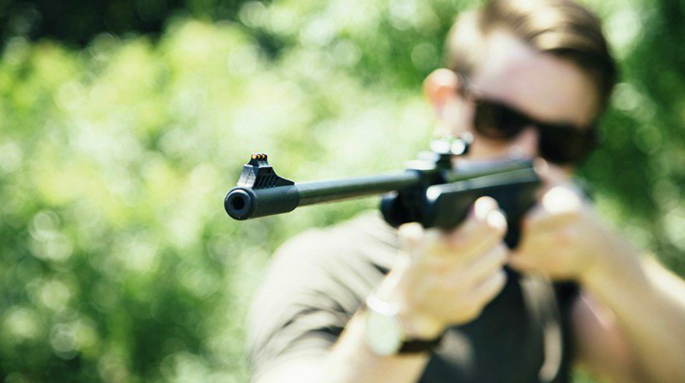 Feature | man in an air rifle shooting position | Air Rifle Shooting Tips | air rifle shooting positions