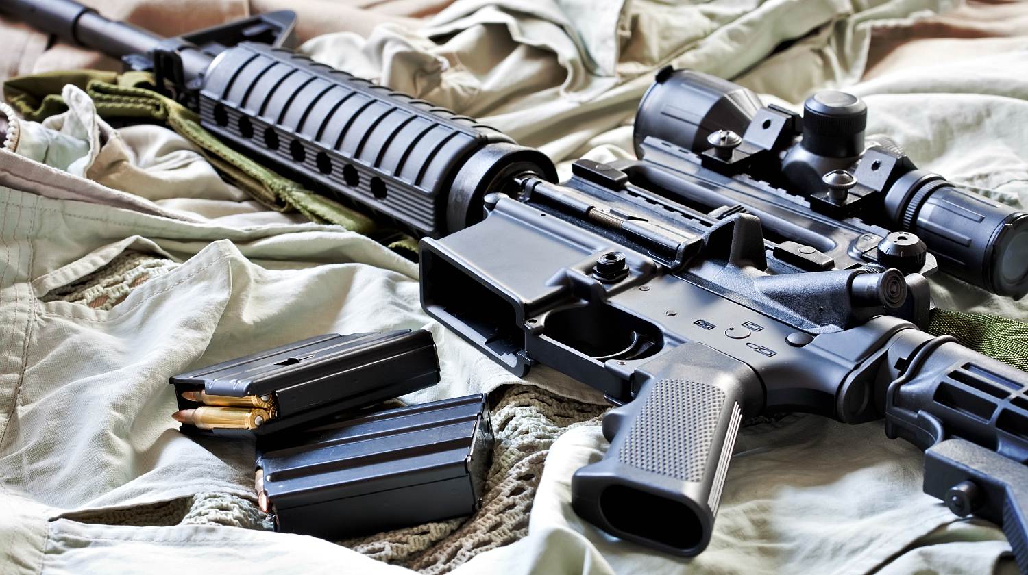 Close-up of AR-15 rifle and magazines with ammo | AR-15 Myths: The Weapon Of Mass Destruction And Assaulting Stuff | Featured
