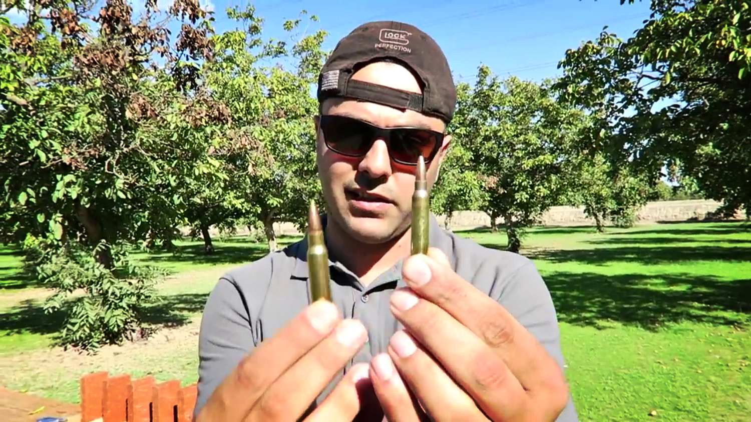 Feature | Man holding different bullets | Rifle Cartridges: .308 Win vs 5.56 Nato
