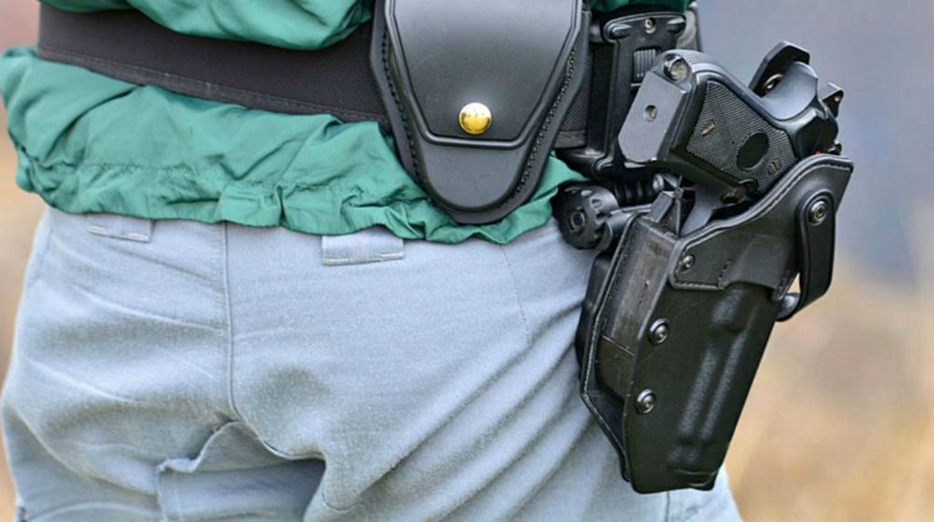 Feature | Man wearing gun holster | The Taurus Pistol Recall: What You Need To Do