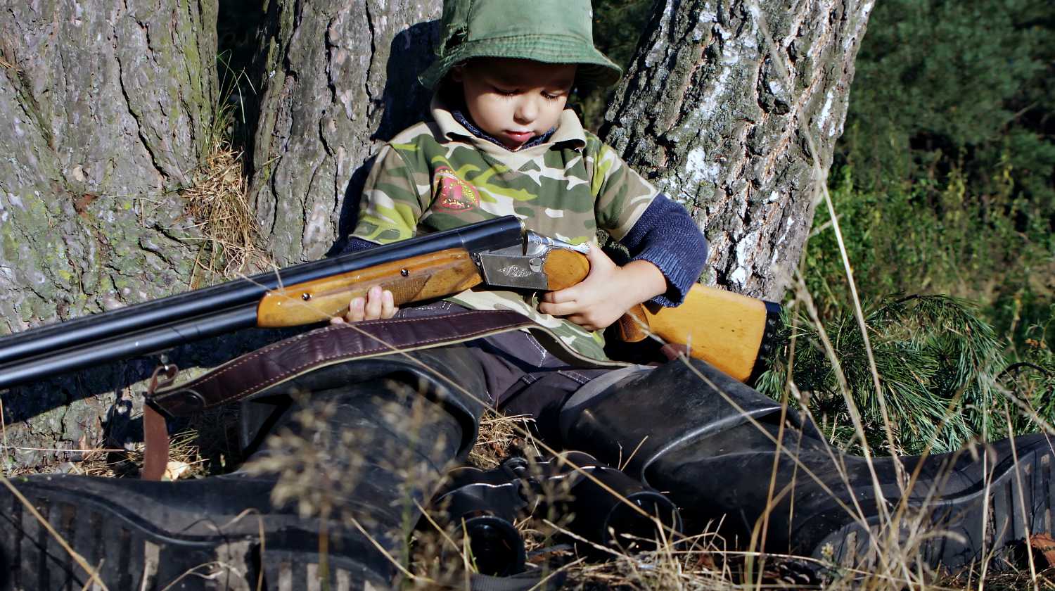 Feature | Boy hunting with gun | Your Child's First Firearm | Options For Your Kids