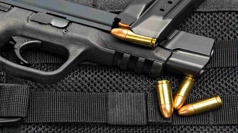 Feature | Tactical handgun carrying bullet proof vest with full spare magazine clip and loose ammunition | Top Handguns In 9mm For Less Than $750