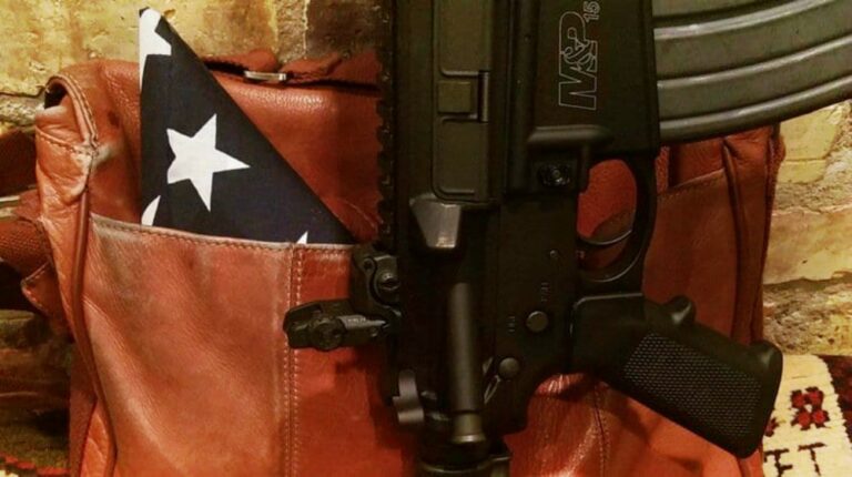 Feature | image of a gun in a gun holder | Flying With Firearms | The Legal And Responsible Way To Do It | flying with a firearm delta