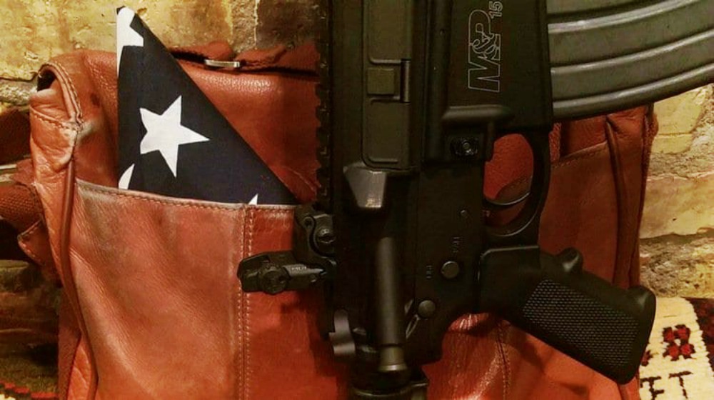 Feature | image of a gun in a gun holder | Flying With Firearms | The Legal And Responsible Way To Do It | flying with a firearm delta