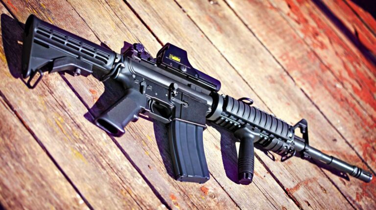 Feature | Rifle on a wooden surface | Gun Modifications | AR-15 Dos and Don'ts