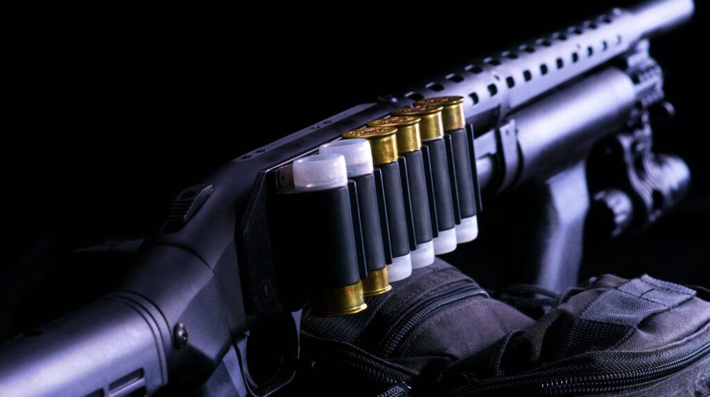 Shotgun, shotgun cartridges on a black background | The Best In Home Defense | Mossberg 500 Tactical | Featured