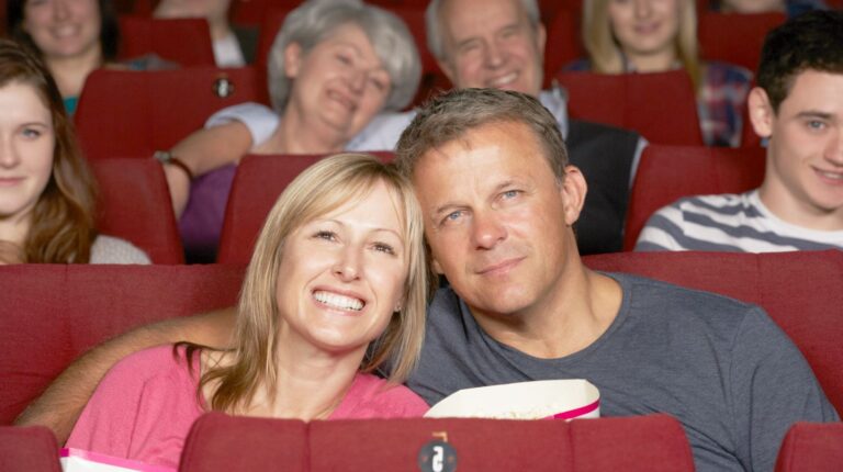 couple watching a movie in cinema | Man Shoots A Woman In Theater And Flees The Scene | Man Shoots A Woman | Featured