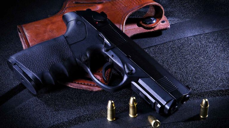 Featured | Gun and holster with bullets | Concealed Carry When New: IWB VS OWB