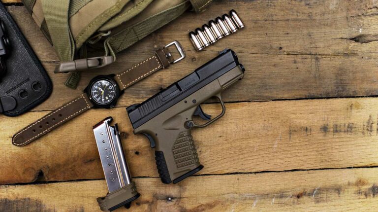 Feature | Handgun, bullets, watch and green bag in wooden table | How To Travel Interstate With Your Firearm