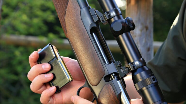 Feature | A hunter loading his hunting rifle gun with magazine | My Favorite Long Distance Rifle Cartridges