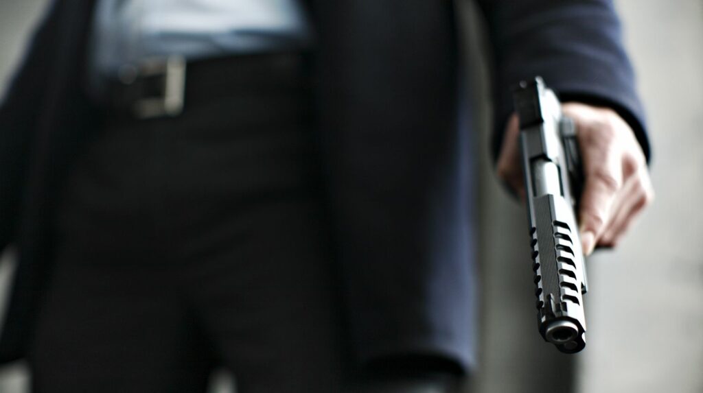 Man holding a .45 caliber gun | Gun Hand: Why Should You Keep It Empty? | Featured