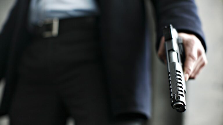 Man holding a .45 caliber gun | Gun Hand: Why Should You Keep It Empty? | Featured