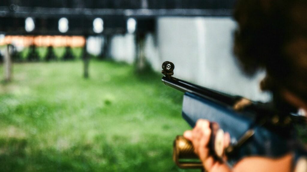 Feature | Man pointing gun on the target | Finding Your Norinco SKS Production Date