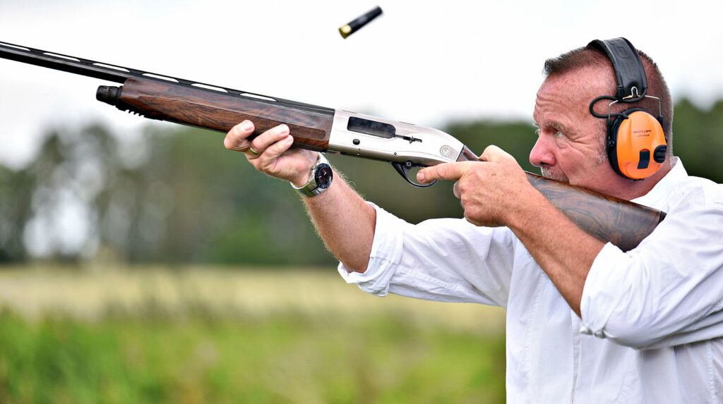 Feature | A man focused on shotgun shooting | Mastering Proper Breathing Techniques To Improve Shot Placement