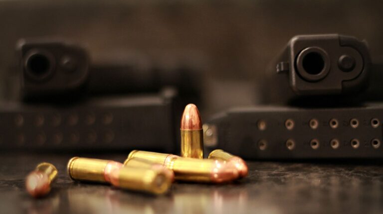 Feature | Two handgun with their magazines and bullets | Caliber Wars | .380 ACP VS 9mm: Which Is Better?