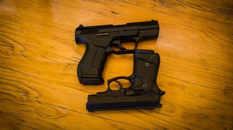 two guns on wooden table